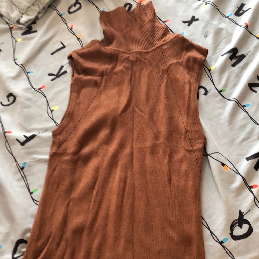 Sleeveless top with turtleneck